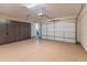 Garage with storage cabinets and overhead storage at 26647 W Covey Ln, Buckeye, AZ 85396