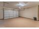 Spacious garage with ample storage and epoxy flooring at 26647 W Covey Ln, Buckeye, AZ 85396