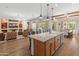 Large kitchen island and open floor plan to living room at 26647 W Covey Ln, Buckeye, AZ 85396