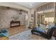 Bright library with stone accent wall and hardwood floors at 26647 W Covey Ln, Buckeye, AZ 85396