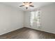 Bright bedroom with wood-look floors and window coverings at 26861 W Adam Ave, Buckeye, AZ 85396