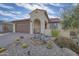 Spanish style home with attractive landscaping and a two-car garage at 26861 W Adam Ave, Buckeye, AZ 85396