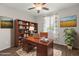 Home office with built-in shelving and a large desk at 26861 W Adam Ave, Buckeye, AZ 85396