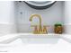 Close-up of a modern gold faucet and sink at 280 E Morelos St, Chandler, AZ 85225