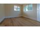 Simple bedroom with wood-look floors and windows at 280 E Morelos St, Chandler, AZ 85225