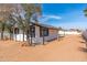 White single story home with black trim and sandy yard at 280 E Morelos St, Chandler, AZ 85225