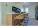 Kitchen island with seating and electric fireplace at 280 E Morelos St, Chandler, AZ 85225