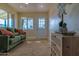 Bright living room with green couch and wood floors at 280 E Morelos St, Chandler, AZ 85225