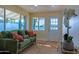 Bright living room with green couch and wood floors at 280 E Morelos St, Chandler, AZ 85225