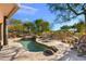 Inviting backyard with a pool, spa, and relaxing lounge area at 3071 Ironwood Rd, Carefree, AZ 85377