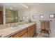 Double vanity bathroom with a large mirror and shower at 3071 Ironwood Rd, Carefree, AZ 85377