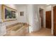 Relaxing bathroom with soaking tub, shower, and tile flooring at 3071 Ironwood Rd, Carefree, AZ 85377