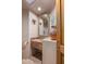 Small bathroom with a single sink and decorative mirror at 3071 Ironwood Rd, Carefree, AZ 85377