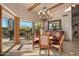 Bright dining room with a wooden table and views at 3071 Ironwood Rd, Carefree, AZ 85377