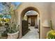 Arch entryway leading to a charming courtyard at 3071 Ironwood Rd, Carefree, AZ 85377