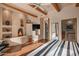 Main bedroom with fireplace, wood floors and ensuite bathroom at 3071 Ironwood Rd, Carefree, AZ 85377