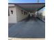 Covered carport with screened sides and a paved driveway at 3104 E Broadway -- # 88, Mesa, AZ 85204