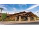 Community clubhouse with stone accents and covered entryway at 3104 E Broadway -- # 88, Mesa, AZ 85204