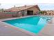 Outdoor community pool with a covered patio area at 3104 E Broadway -- # 88, Mesa, AZ 85204