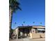 Single-wide manufactured home with carport and desert landscaping at 3104 E Broadway -- # 88, Mesa, AZ 85204