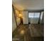 Home hallway with tile flooring, storage cabinets and a carpet at 3104 E Broadway -- # 88, Mesa, AZ 85204