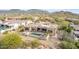 Aerial view of a home with a pool, spa, covered patio, and fenced backyard at 3254 N Ladera Cir, Mesa, AZ 85207