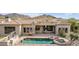 Beautiful backyard featuring a pool, spa, and outdoor living area with a spiral staircase at 3254 N Ladera Cir, Mesa, AZ 85207