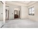 Spacious bedroom featuring neutral carpet, doorway to a vanity, and a mirrored closet slider at 3254 N Ladera Cir, Mesa, AZ 85207