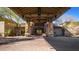 Grand building entrance featuring a stone facade, covered entryway, and professionally landscaped surroundings at 3254 N Ladera Cir, Mesa, AZ 85207