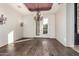 Formal dining room featuring hardwood floors, a chandelier, and outdoor access at 3254 N Ladera Cir, Mesa, AZ 85207