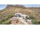 Stunning desert home with mountain views, a circular driveway, and beautiful desert landscaping at 3254 N Ladera Cir, Mesa, AZ 85207