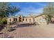 Expansive, single-story home featuring a brick driveway and desert landscaping at 3254 N Ladera Cir, Mesa, AZ 85207