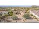 Aerial view of the home's front exterior showing desert landscaping, and tile roof at 3254 N Ladera Cir, Mesa, AZ 85207