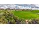 Lush green golf course in a residential community with well-maintained fairways and mature landscaping at 3254 N Ladera Cir, Mesa, AZ 85207