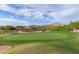 Picturesque golf course featuring vibrant green lawns, scenic mountains, and clear blue skies at 3254 N Ladera Cir, Mesa, AZ 85207