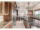 Spacious kitchen featuring stainless steel appliances, a large island, and custom cabinetry at 3254 N Ladera Cir, Mesa, AZ 85207