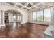 Elegant living room features decorative columns, fireplace, and large windows at 3254 N Ladera Cir, Mesa, AZ 85207