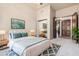 Tranquil main bedroom featuring a king bed, soft lighting, and an open layout with views of the backyard at 3254 N Ladera Cir, Mesa, AZ 85207