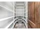 Spacious walk-in pantry featuring floor-to-ceiling shelving and a wine refrigerator at 3254 N Ladera Cir, Mesa, AZ 85207