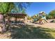 Community playground featuring a covered picnic area and play structure surrounded by greenery at 3254 N Ladera Cir, Mesa, AZ 85207