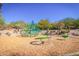 Community playground featuring modern equipment and a wood chip safety surface at 3254 N Ladera Cir, Mesa, AZ 85207