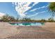 Community pool featuring a clear blue pool and plenty of seating for residents to enjoy under a sunny sky at 3254 N Ladera Cir, Mesa, AZ 85207