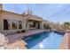 Beautiful backyard with pool, spa, fire pit, and spiral staircase to roof deck at 3254 N Ladera Cir, Mesa, AZ 85207