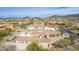 Aerial view of home's rear exterior showing multiple windows and tile roof at 3254 N Ladera Cir, Mesa, AZ 85207