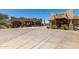 Exterior view of the clubhouse restaurant with a golf pro shop on the other side of the porte-cochere at 3254 N Ladera Cir, Mesa, AZ 85207