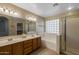 Bathroom with double vanity and glass shower at 3404 E Los Altos Rd, Gilbert, AZ 85297