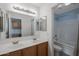 Bathroom with double vanity, a bathtub, and a separate toilet at 3404 E Los Altos Rd, Gilbert, AZ 85297