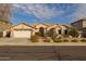 Single-story house with two-car garage, desert landscaping, and neutral color scheme at 3404 E Los Altos Rd, Gilbert, AZ 85297