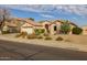 Tan house exterior with cacti and a two-car garage at 3404 E Los Altos Rd, Gilbert, AZ 85297