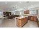 Kitchen with large island, and views to Gathering room at 3404 E Los Altos Rd, Gilbert, AZ 85297